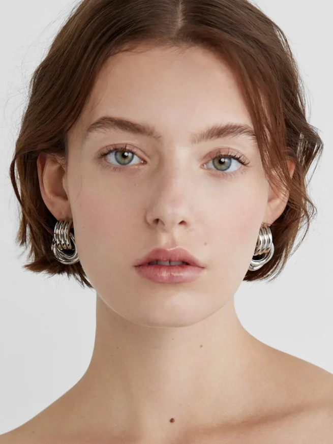 Gold plated multi layer stainless steel earrings with twisted circle knots